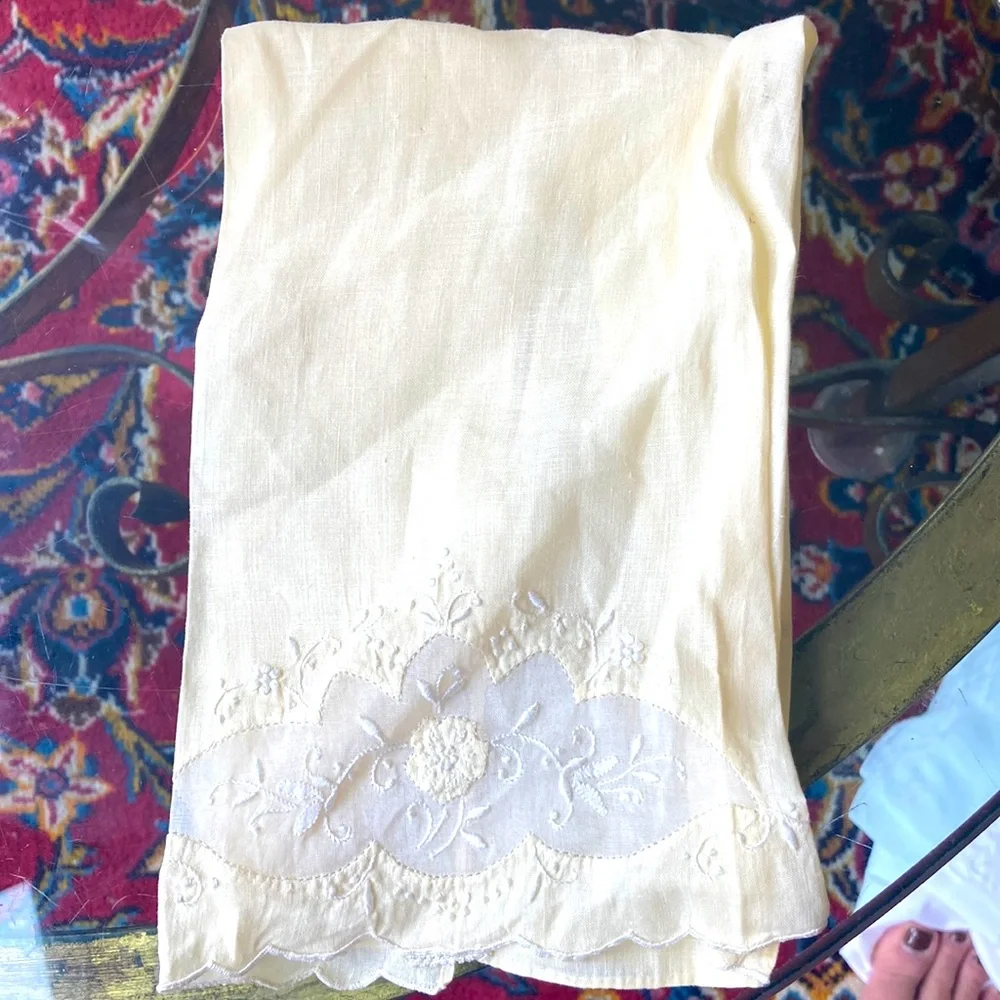 One fine linen embroidered tea towels. A muted butter yellow Vintage 1960s